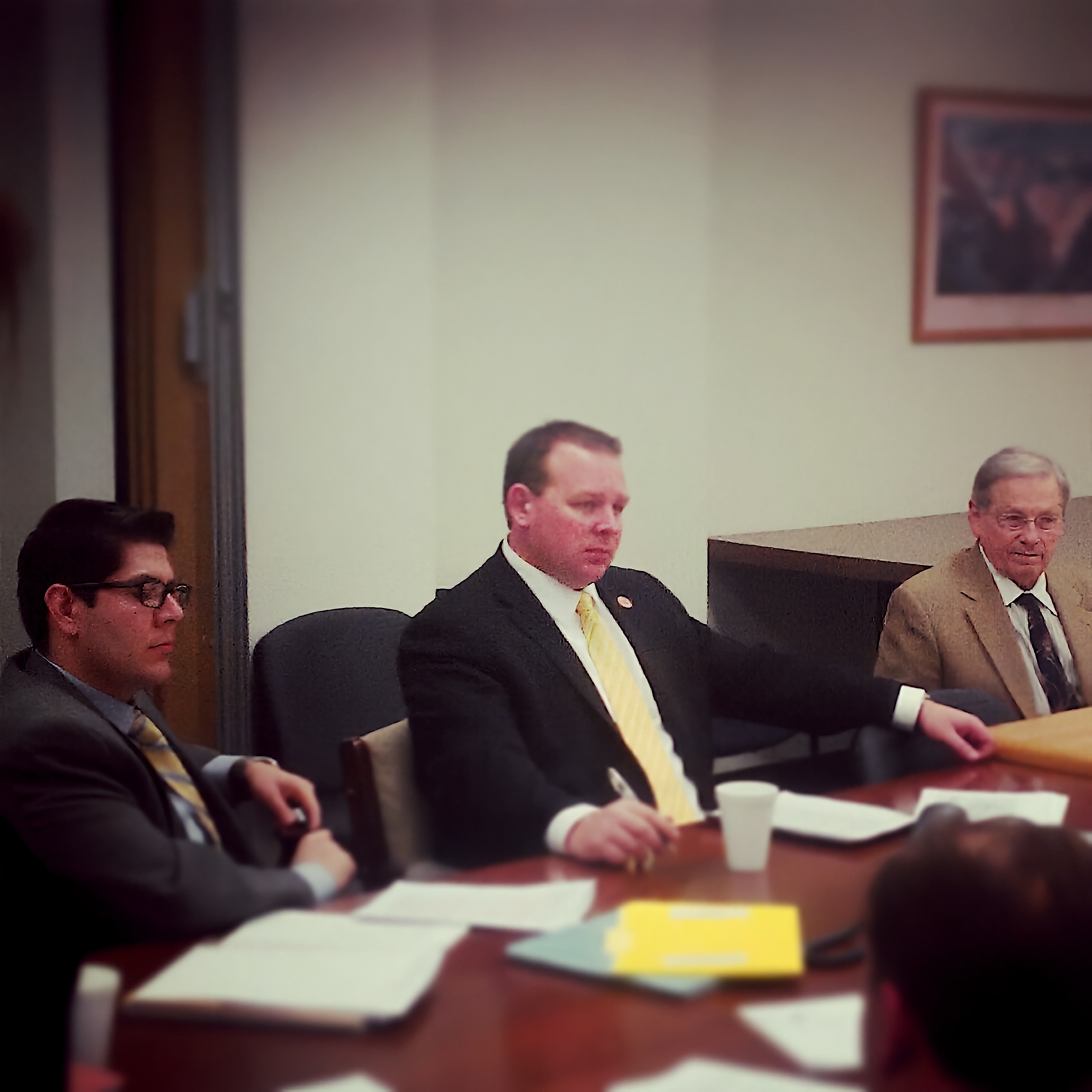 Representative Jeff Dial working on legislation at a conference table at the Arizona State Legislature